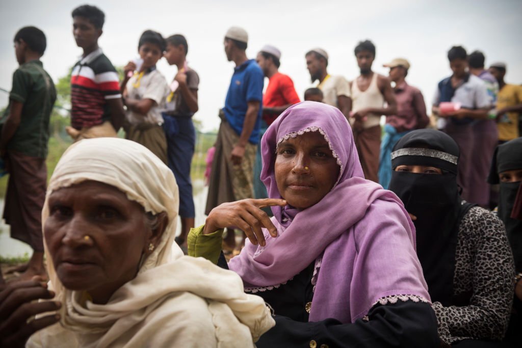 Rohingya women and men wait in line for a humanitarian aid distribution at Chakmarkul refugee camp in Bangladesh. (October 28, 2017)